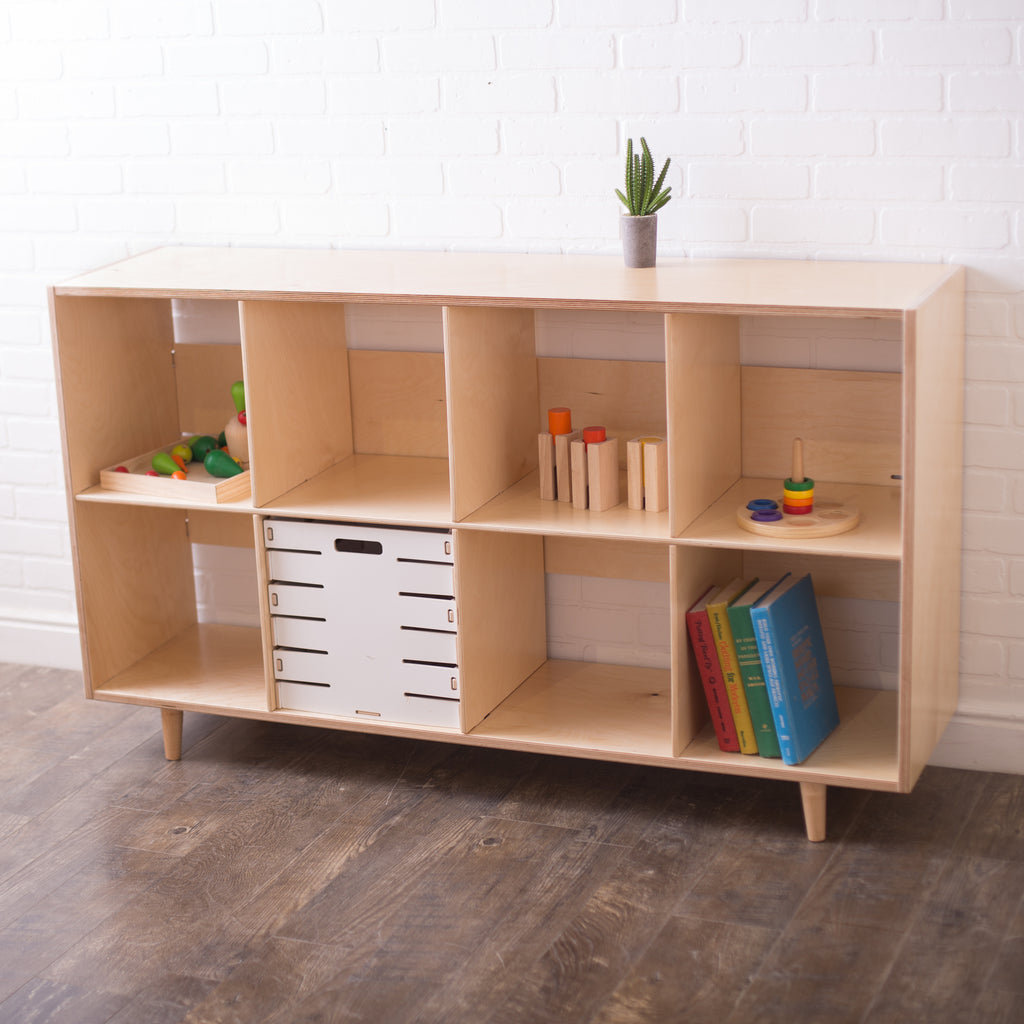 Birch wooden eight cube shelf for organizing. In a studio setting with books and Montessori learning resources on the shelves.