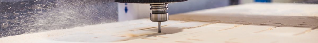 phot of plywood being machined by a cnc router