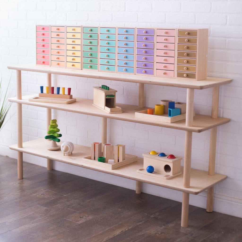 Open Wood Shelves for the Montessori Home or Classroom -- Here seen with an array of toys on the first two levels with multicolored organizing bins up top.