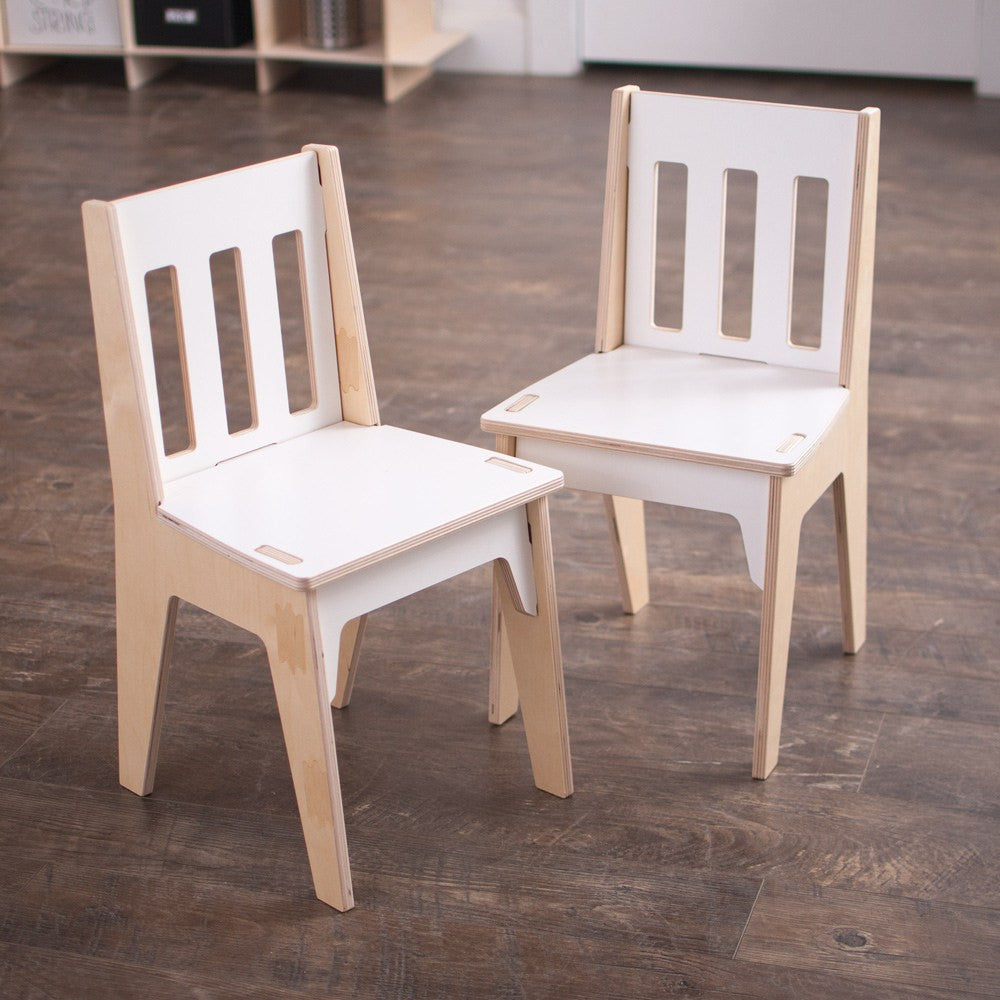 Two birch two tone school kids chairs in a studio setting.