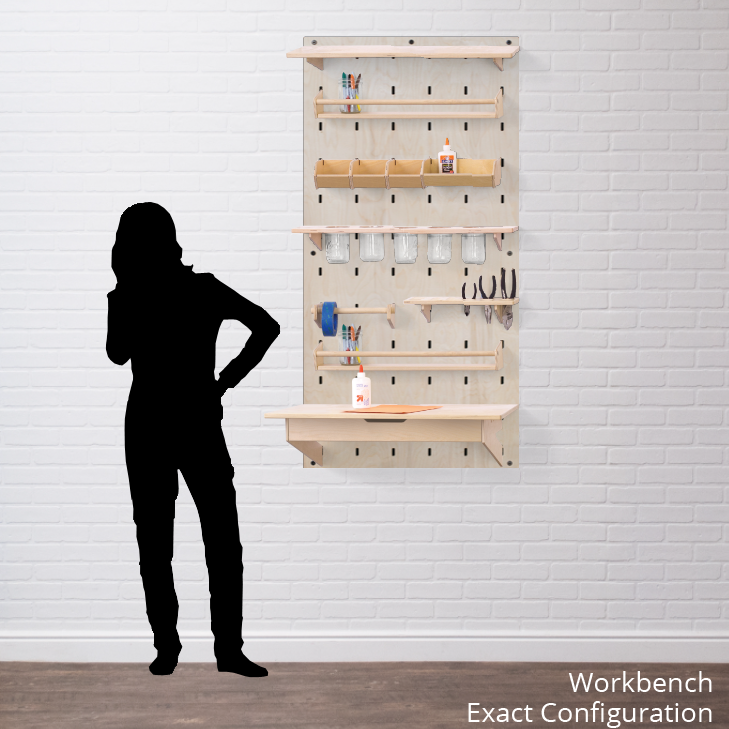 A wall mounted pegboard showing various attachments intended to be used as a workbench