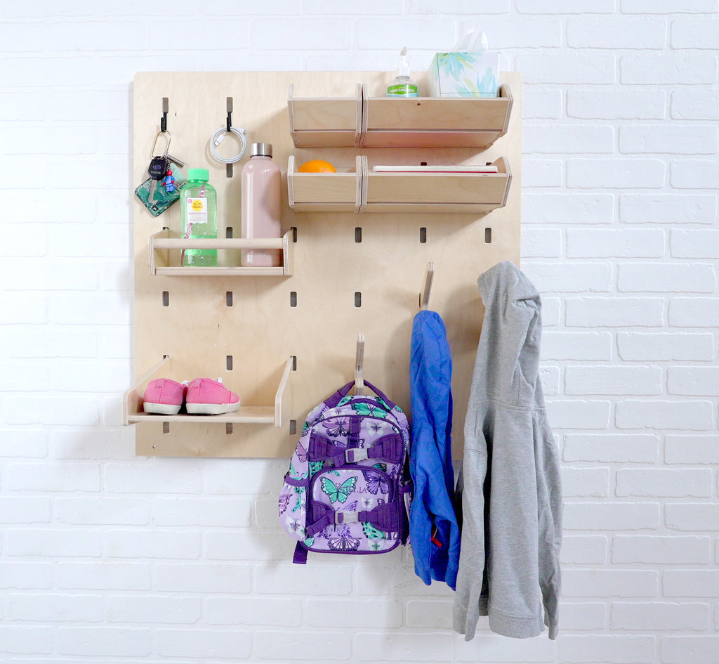 Entryway organization Makerwall  with jackets, backpacks and keys.
