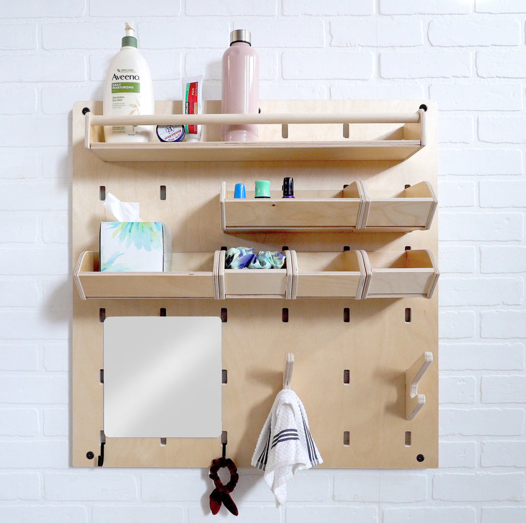 Self care station pegboard with items like lotions, hairties and a mirror