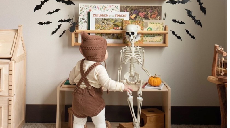 Child with Halloween Decor