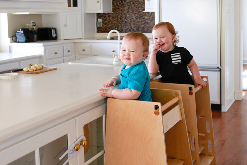 Children at the kitchen counter in Toddler towers