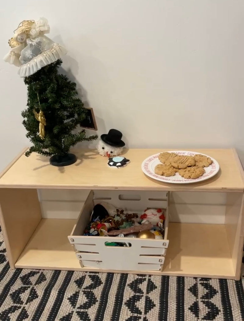 Infant shelf prepared with holiday decor