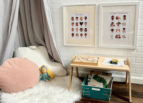 an example of a calm corner setup with soft pillows and rug, a basket of books, and a floor table with calming activities on it