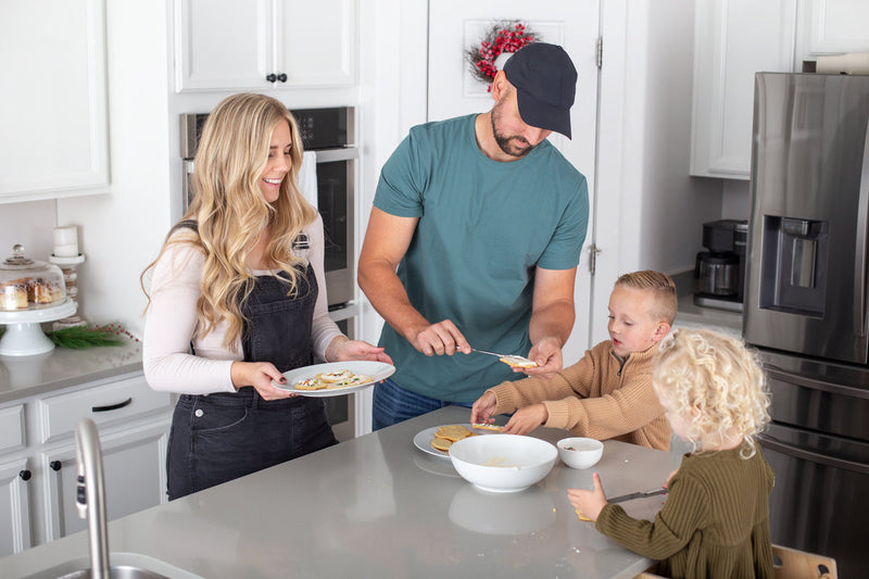 Family Decorating cookies in a kitchen 