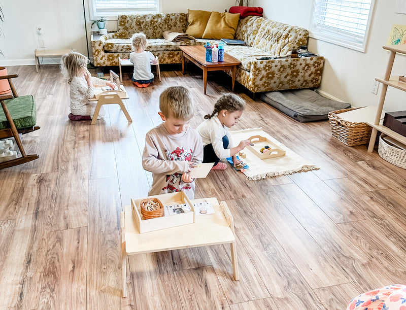 Children doing activities at Floor Tables