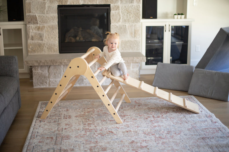 Child balancing on the ramp of a Climbing Triangle