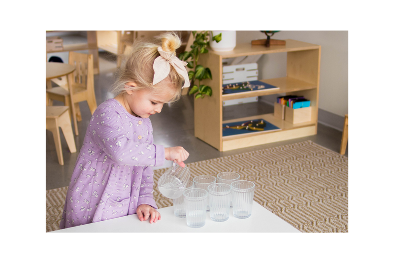 Girl pouring water into glass cups