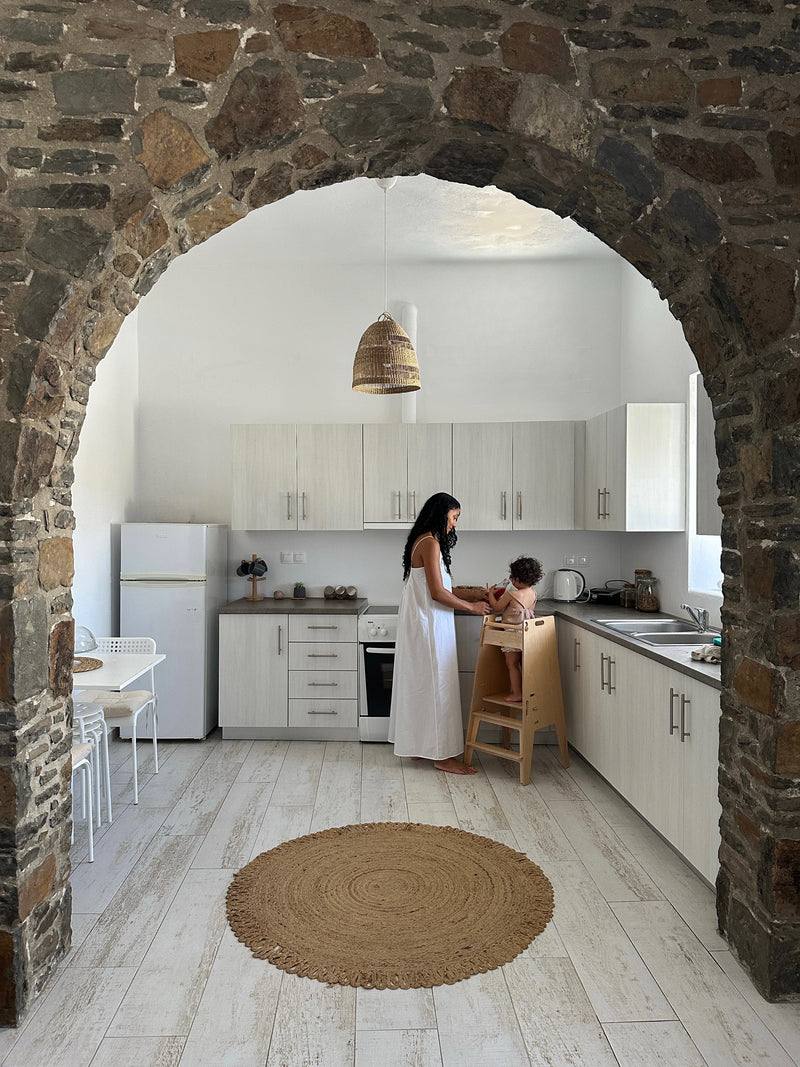 Woman and Toddler in the Kitchen with a Toddler Tower