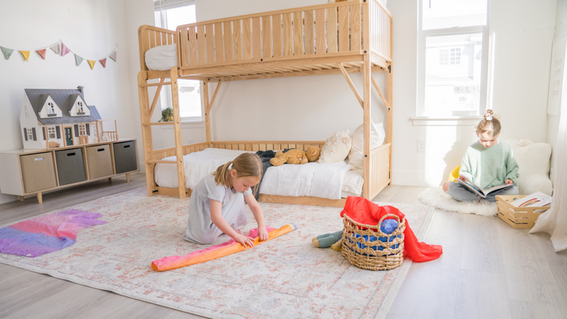 Children playing in a bedroom with a bunk bed