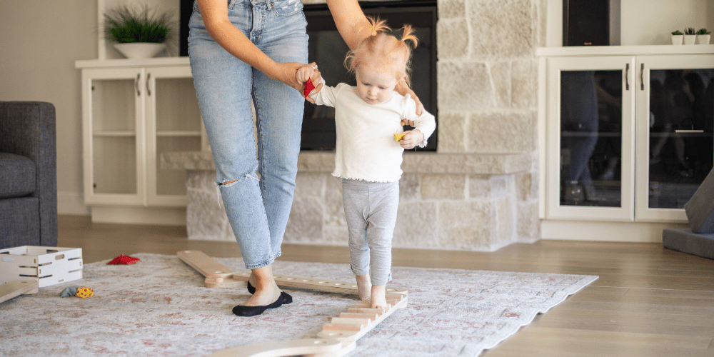 Kids playing in front of a bookshelf in a Living Room