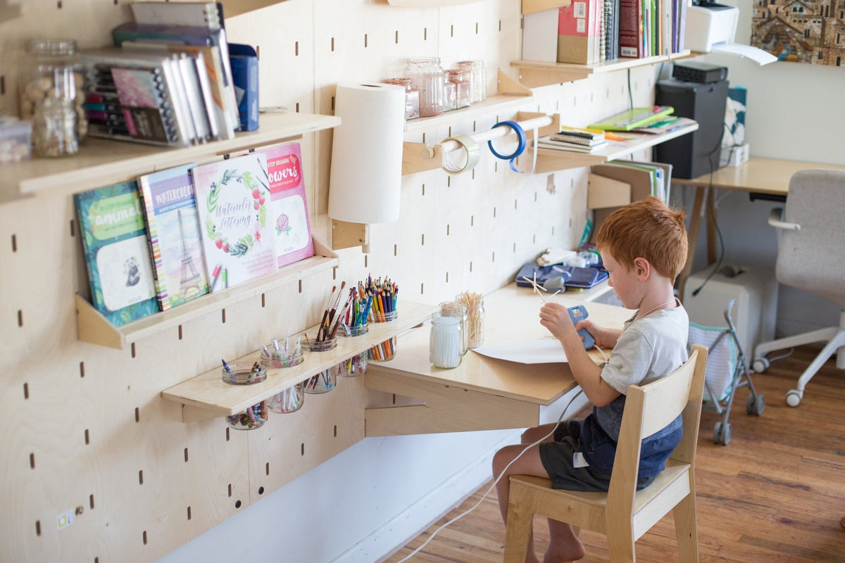Child crafting at a Makerwall Desk