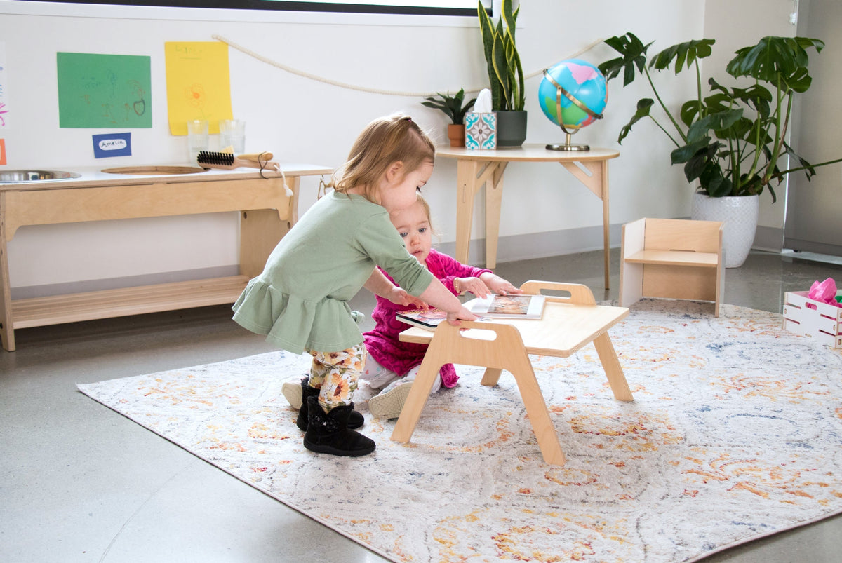 Two young girls with a Chowki Floor Table
