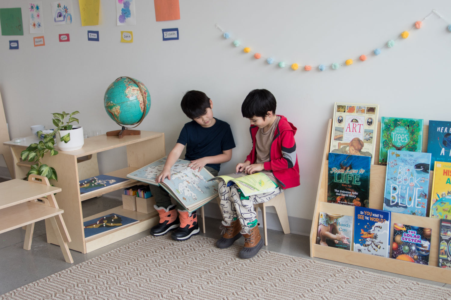 Two boys sitting and reading at school