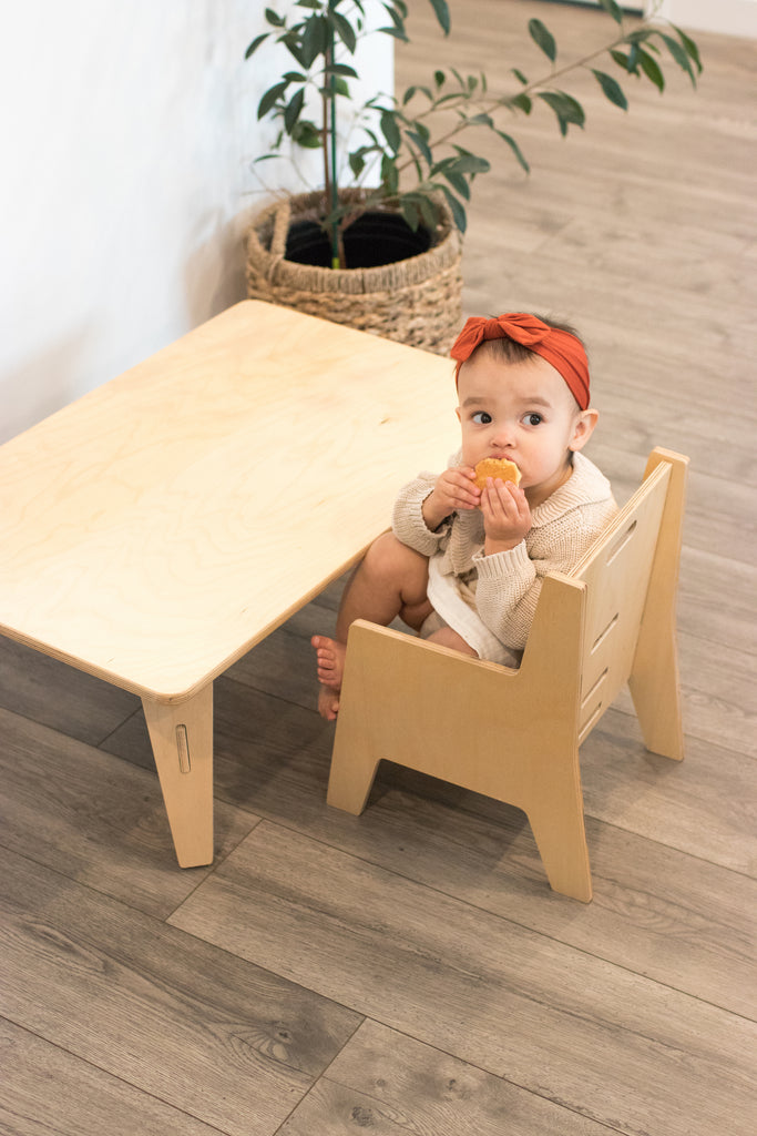 Baby sitting in Toddler Table and Chair Set