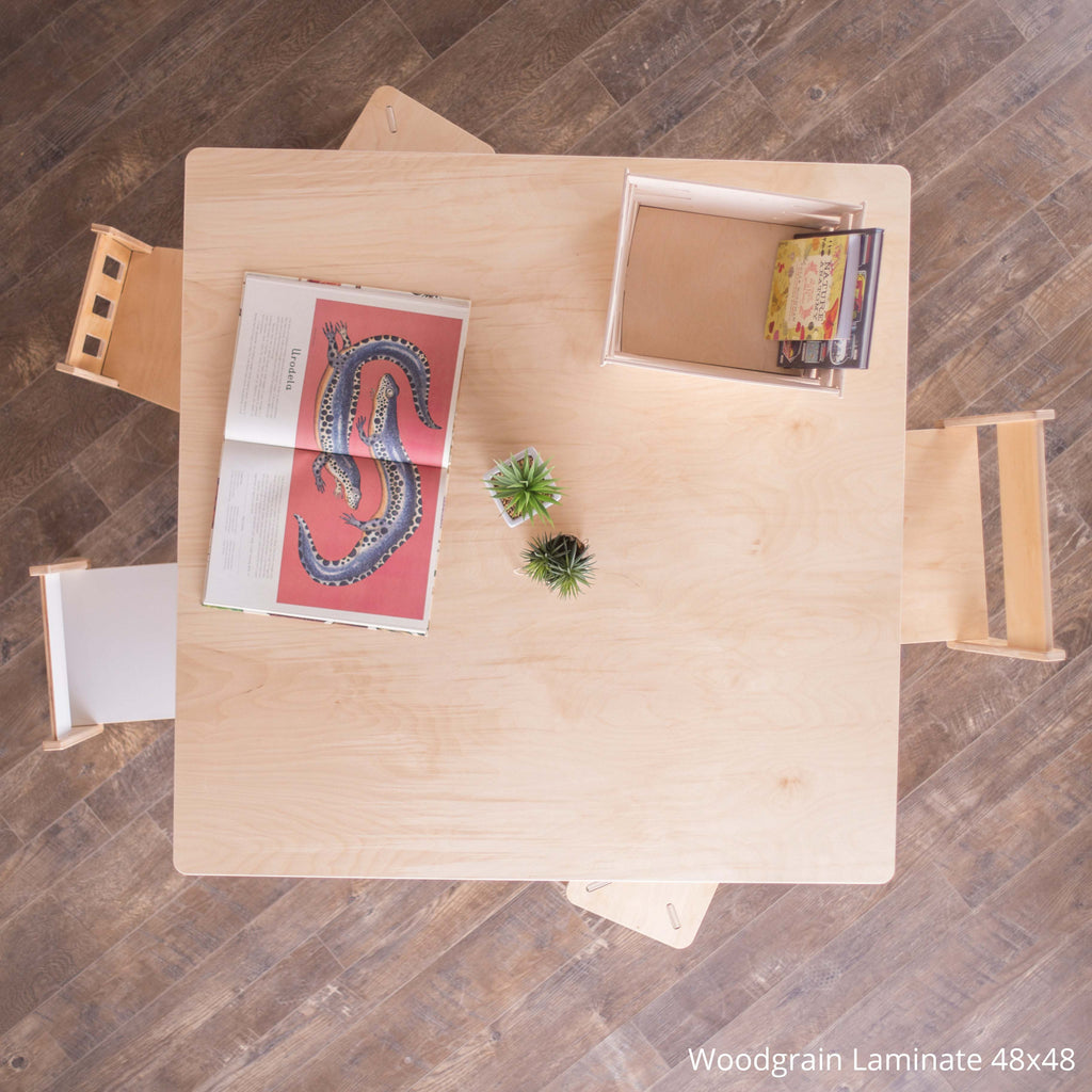 Wooden desk with items on a wooden floor