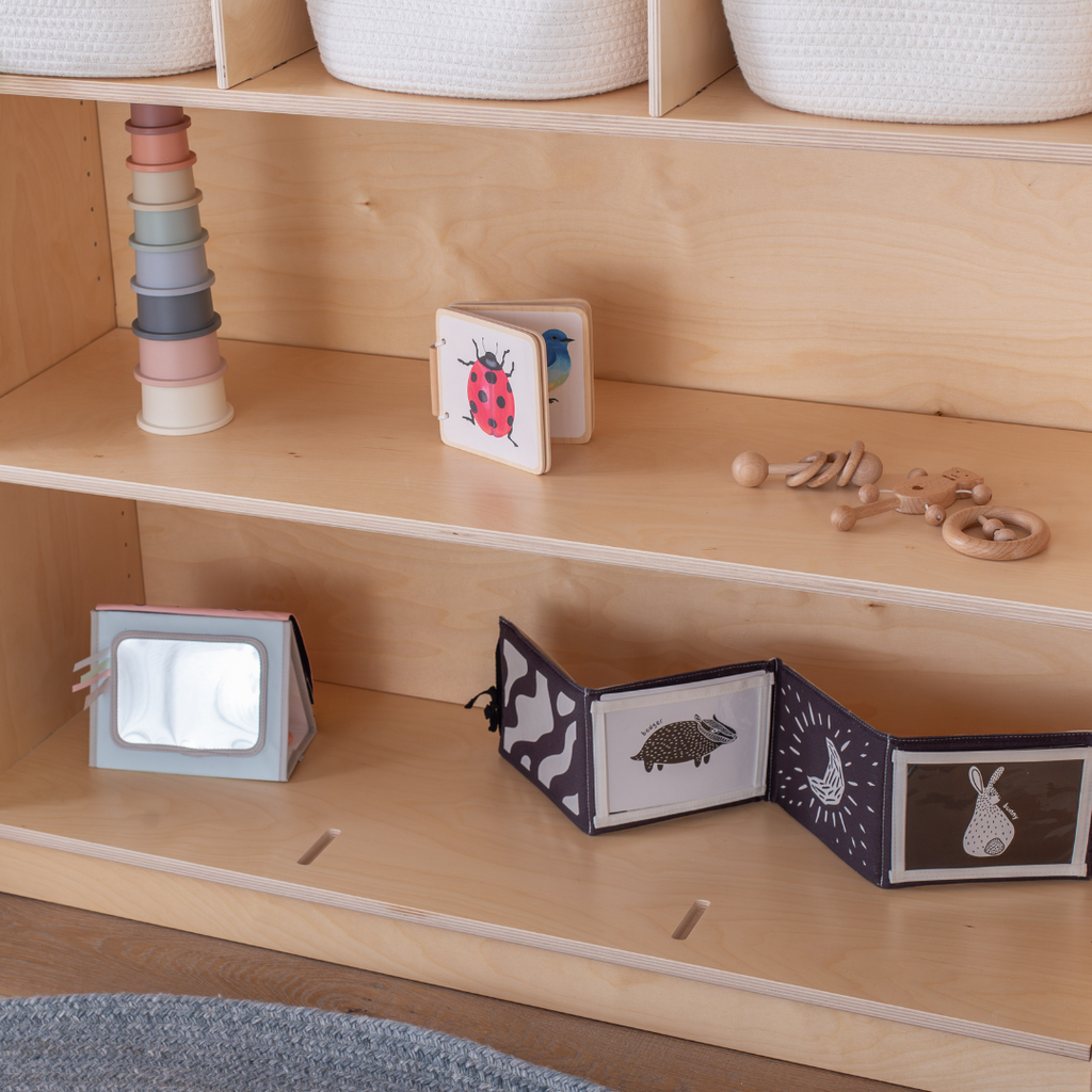 A detail shot of the shelf on the bottom of the Adjustable Toy Organizer