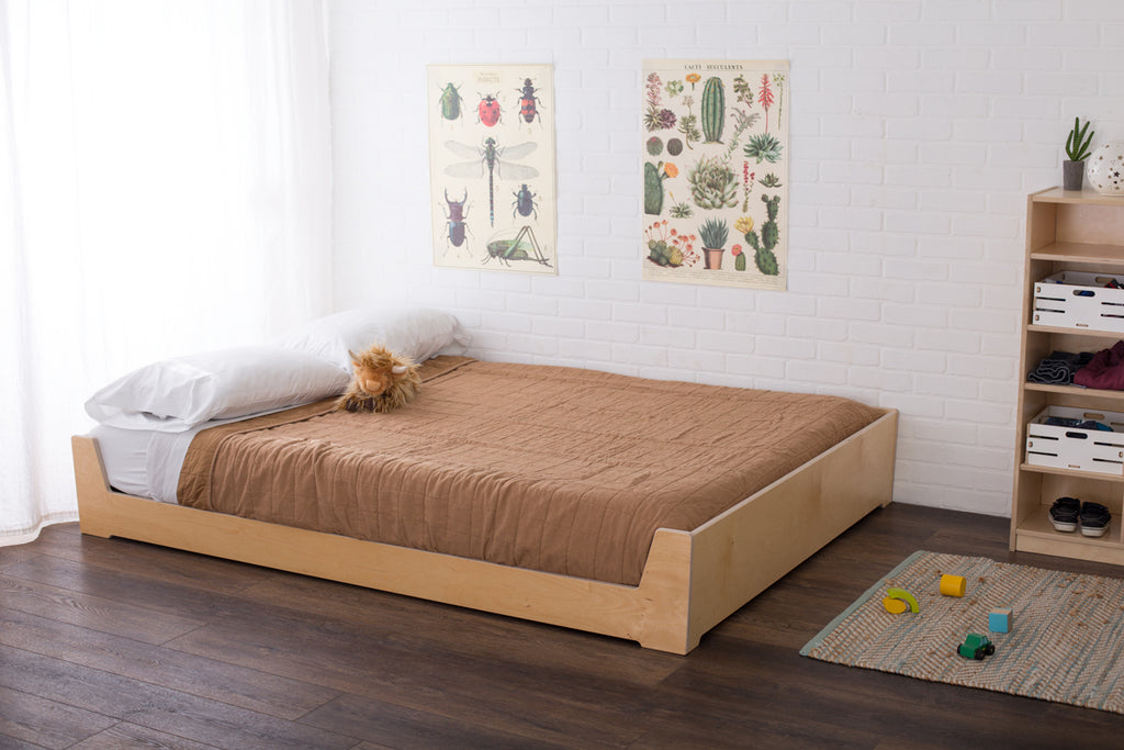 Birch full size Montessori floor bed in the low position