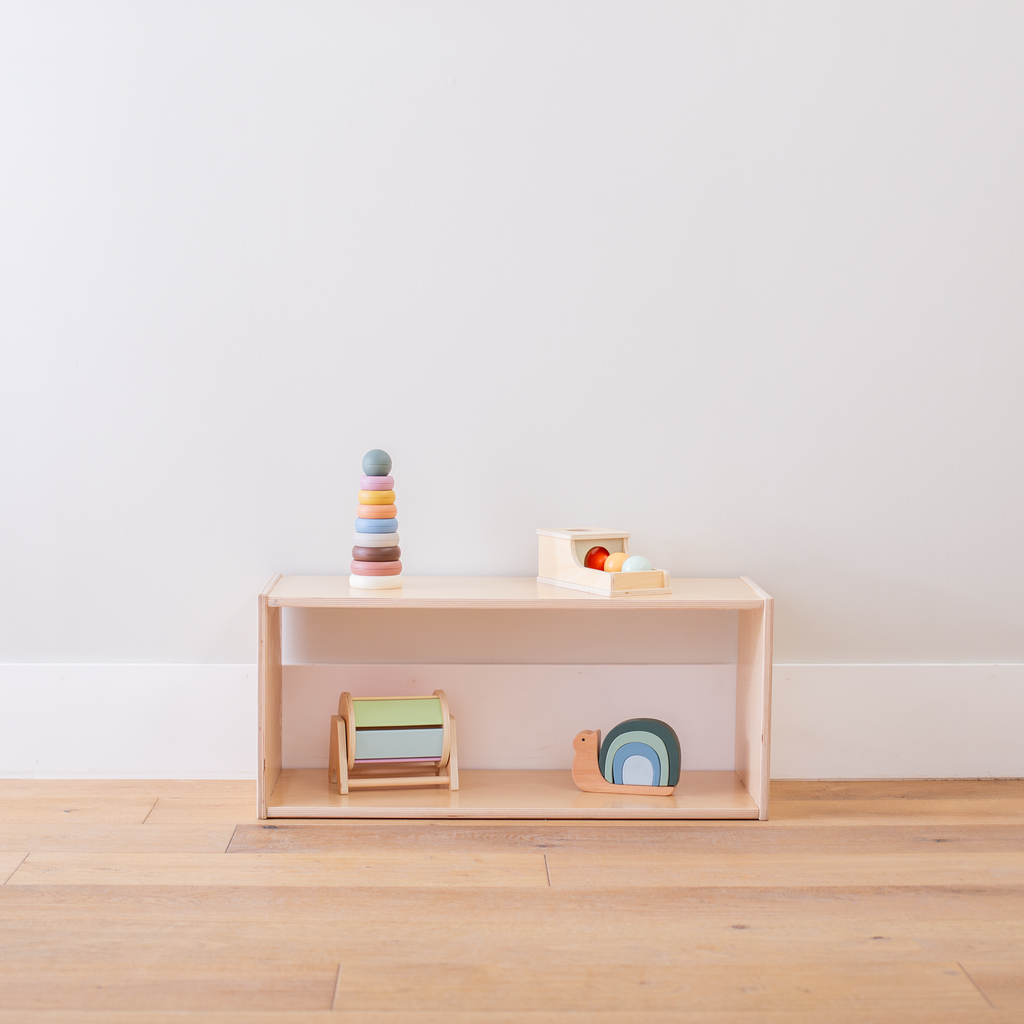 Short infant toy shelf without a back with toys