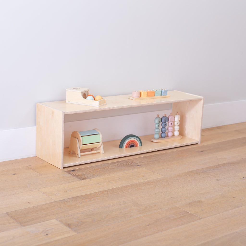 Long Backless Infant Shelf at an angle with toys