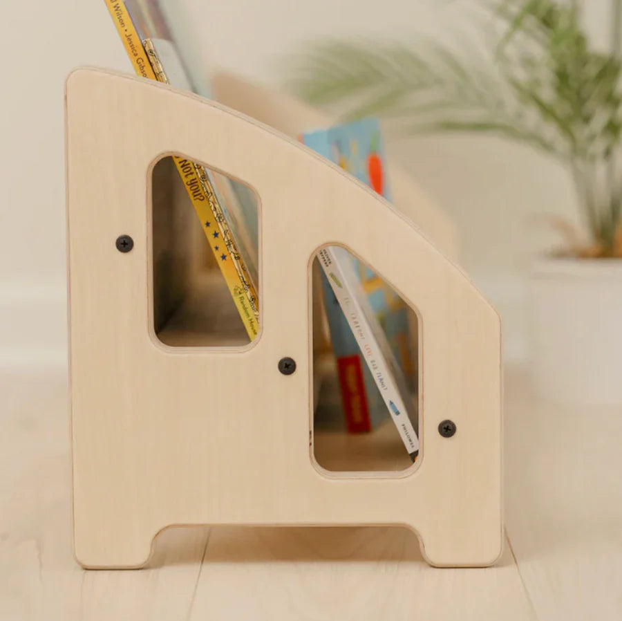 Wooden bookend with books on a surface