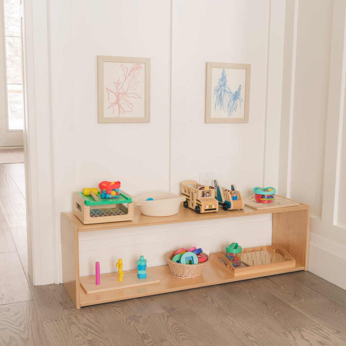 Wooden toy shelf with educational toys in a bright room