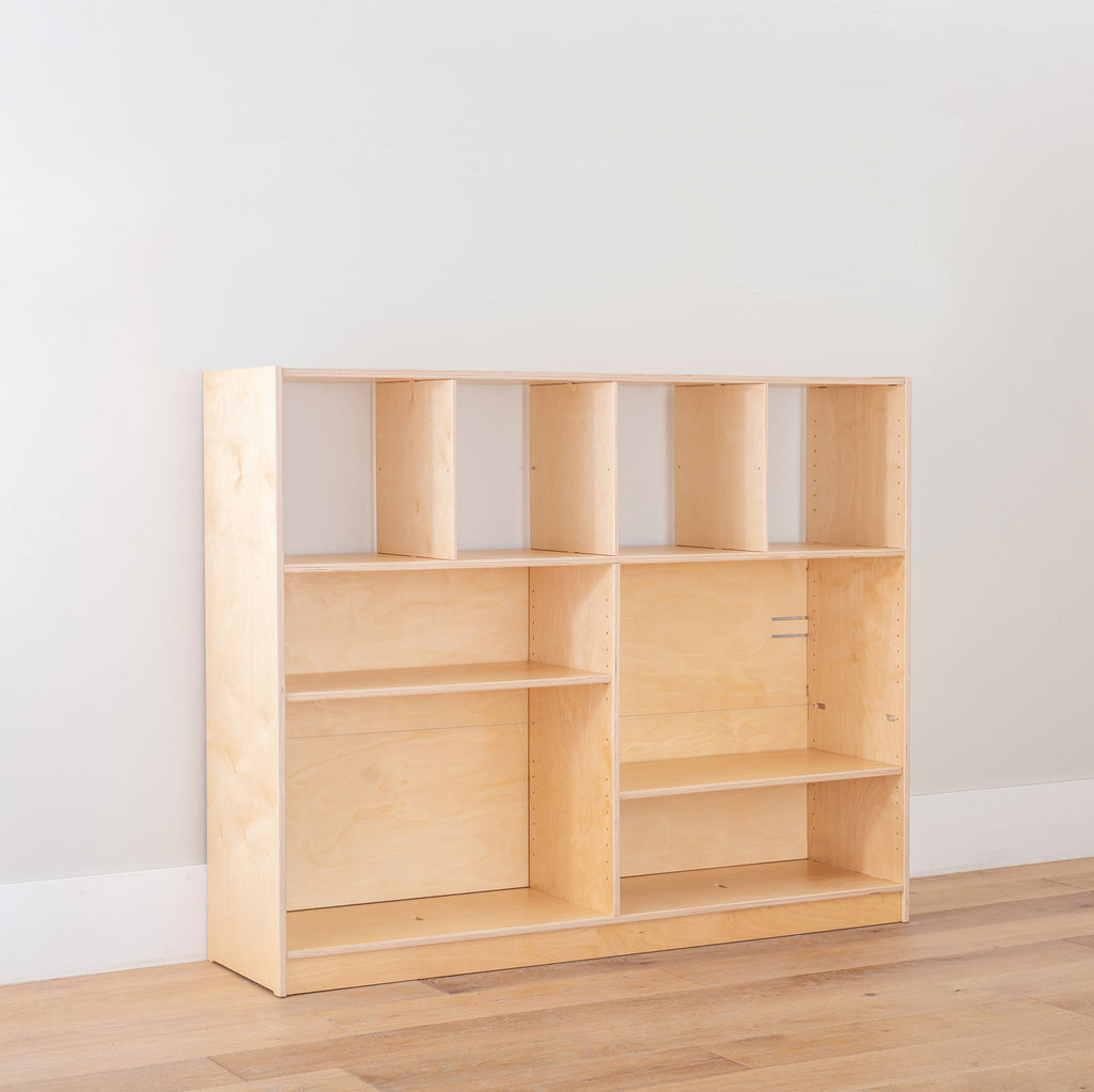 The Toy Organizer with 4 cubes with the adjustable shelves shown at different heights. 