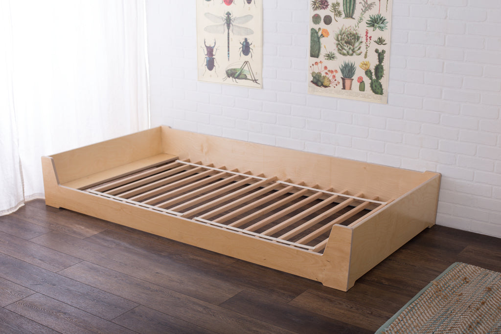 A Montessori Bed without a mattress showing oak slats