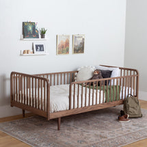 Montessori bed with rails in walnut on legs