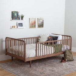 Toddler bed with rails in walnut on legs