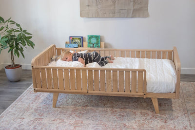 Child in Twin Toddler Bed with Rails