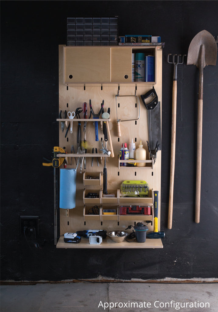 A wall mounted too storage set showing various attachments and tools displayed
