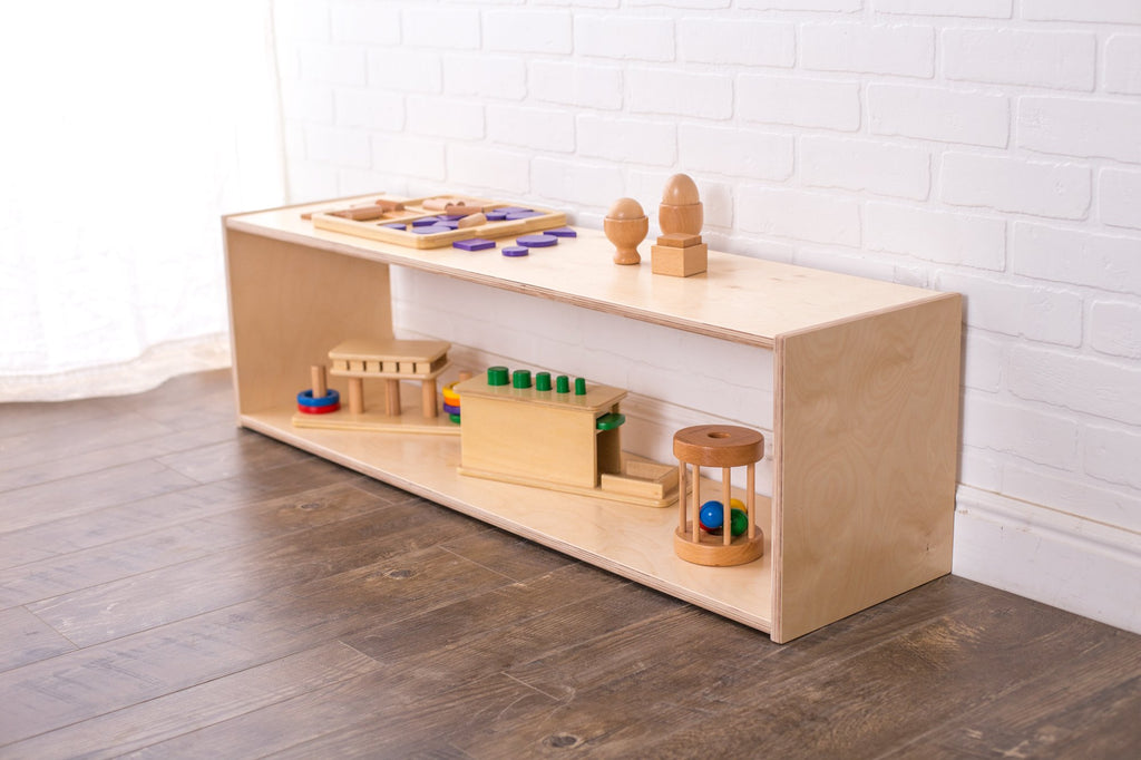 Infant toy organizer shelf displaying wooden toys
