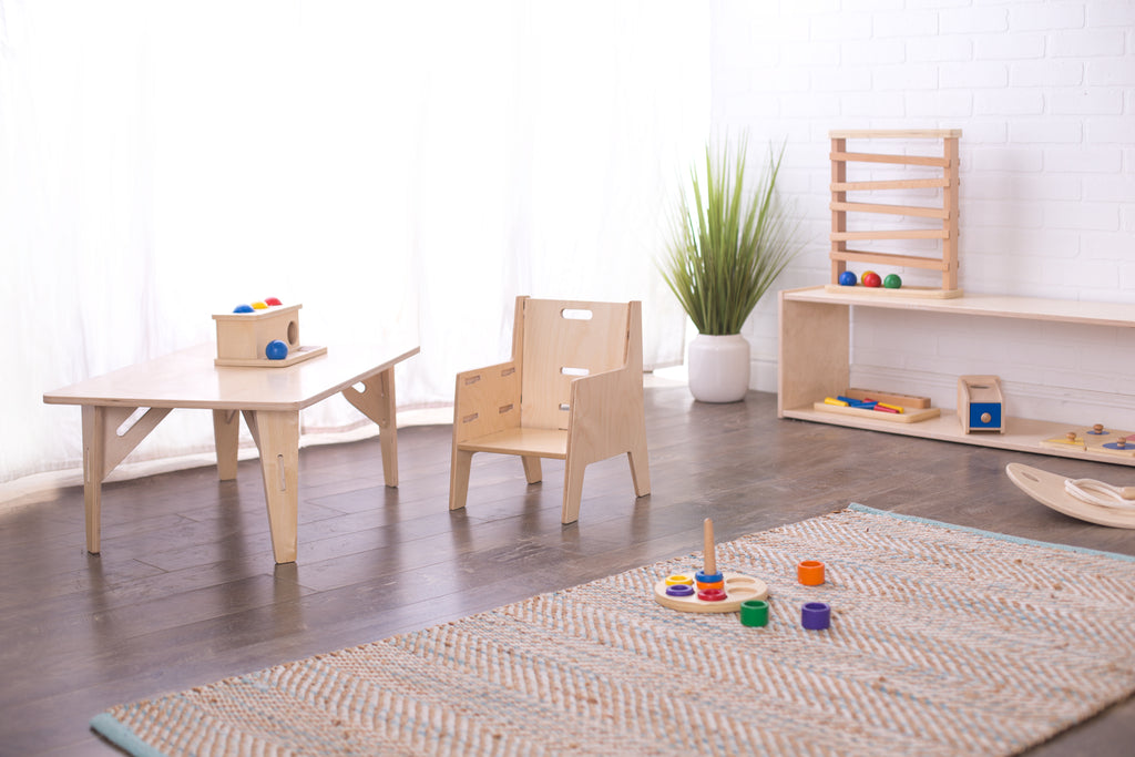 Kids table and chair with other playroom furniture