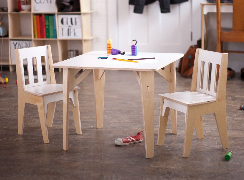 childrens table and chairs set in white and birch two-tone with wooden peg dolls on top